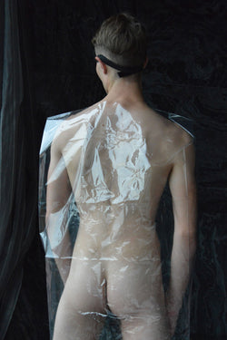 Ross Watson photography of naked man wrapped in plastic viewed from behind